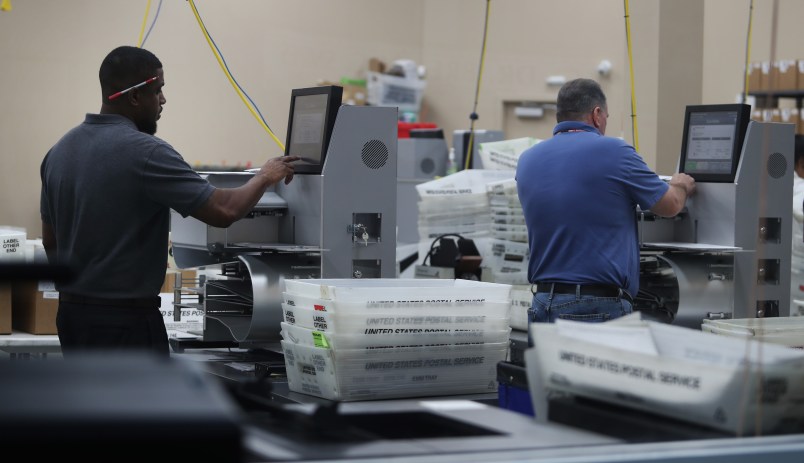 Employees of the Broward County Supervisor of Election's office in Lauderhill, Fla. counts ballots from the Mid-term election Thursday, Nov. 8, 2018. (Carline Jean/Sun Sentinel/TNS)
