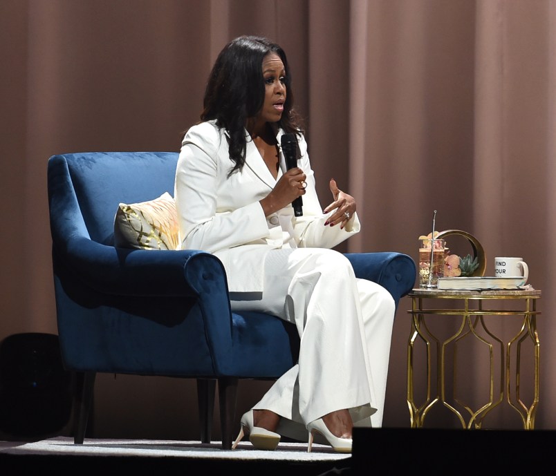 Former First Lady and author Michelle Obama speaks onstage with Tracee Ellis Ross at Becoming: An Intimate Conversation with Michelle Obama at the Forum on November 15, 2018 in Inglewood, California.