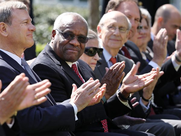 U.S. Supreme Court Associate Justice Anthony Kennedy administers the judicial oath to Judge Neil Gorsuch as President Donald Trump looks on during a ceremony in the Rose Garden at the White House April 10, 2017 in Washington, DC. Earlier in the day Gorsuch, 49, was sworn in as the 113th Associate Justice in a private ceremony at the Supreme Court.
