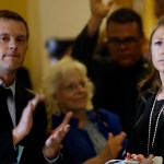 AUGUSTA, ME - JULY 1: House Majority Leader Erin Herbig and House Assistant Majority Leader Jared Golden, left, are met by applause at the State House by dozens of state workers on Saturday, July 1, 2017, the first day of Maine’s government shutdown following a a budget impasse that has yet to be resolved. (Staff photo by Derek Davis/Staff Photographer)
