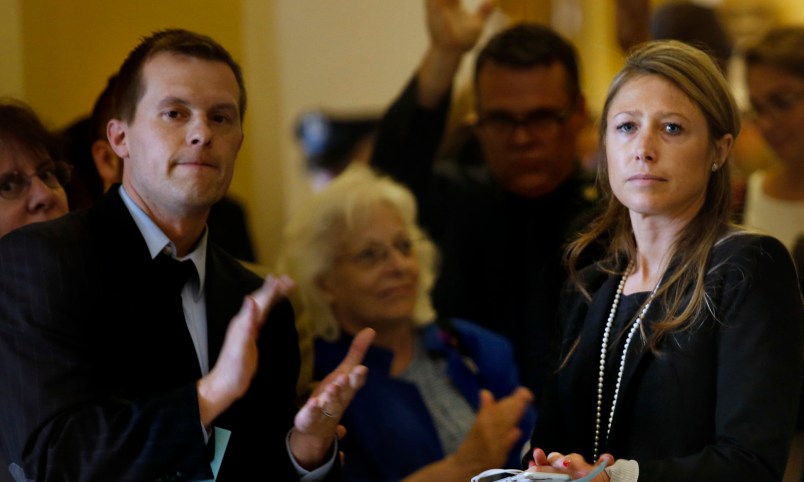 AUGUSTA, ME - JULY 1: House Majority Leader Erin Herbig and House Assistant Majority Leader Jared Golden, left, are met by applause at the State House by dozens of state workers on Saturday, July 1, 2017, the first day of Maine’s government shutdown following a a budget impasse that has yet to be resolved. (Staff photo by Derek Davis/Staff Photographer)
