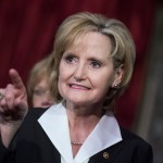 UNITED STATES - APRIL 9: Sen. Cindy Hyde-Smith, R-Miss., attends her swearing-in ceremony the Capitol's Old Senate Chamber after being sworn in on the Senate floor on April 9, 2018. (Photo By Tom Williams/CQ Roll Call)