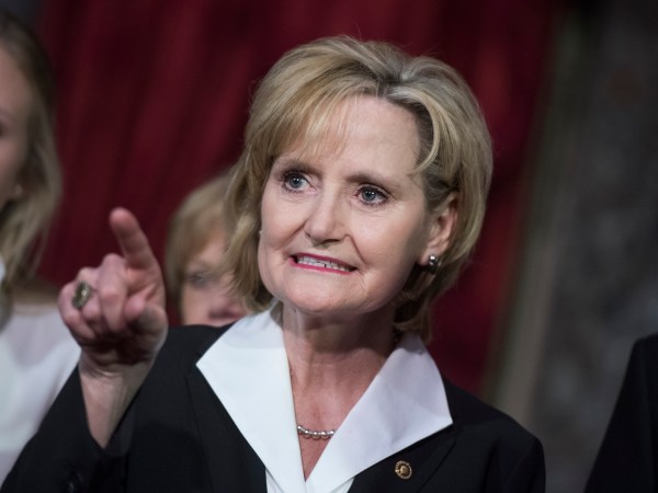 UNITED STATES - APRIL 9: Sen. Cindy Hyde-Smith, R-Miss., attends her swearing-in ceremony the Capitol's Old Senate Chamber after being sworn in on the Senate floor on April 9, 2018. (Photo By Tom Williams/CQ Roll Call)