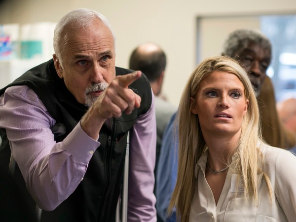 Alaska House District 1 candidate Republican Bart LeBon points to a vote tally board with his campaign manager Brittany Hartmann during a election recount at the Department of Elections' Juneau office on Friday, Nov. 30, 2018. A single mystery ballot found on a precinct table on Election Day but not counted then could decide a tied Alaska state House race and thwart Republican efforts to control the chamber and all of state government. The ballot arrived in Juneau last Friday in a secrecy sleeve in a bin with other ballot materials. Officials were investigating its origins and handling before deciding whether to tally it. Michael Penn/Juneau Empire via AP)