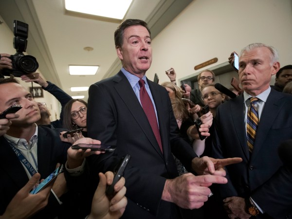 Former FBI Director James Comey, with his attorney, David Kelley, right, speaks to reporters after a day of testimony compelled by the GOP-led House Judiciary and Oversight committees, on Capitol Hill in Washington, Friday, Dec. 7, 2018.  (AP Photo/J. Scott Applewhite)