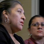 Sandra Diaz, right, listens as Victorina Morales, right recall her experience working at President Donald Trump's golf resort in Bedminster, N.J., during an interview, Friday Dec. 7, 2018, in New York. Both Morales and Diaz say they used false legal documents to get hired at the resort and supervisors knew it. (AP Photo/Bebeto Matthews)