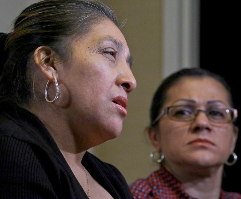 Sandra Diaz, right, listens as Victorina Morales, right recall her experience working at President Donald Trump's golf resort in Bedminster, N.J., during an interview, Friday Dec. 7, 2018, in New York. Both Morales and Diaz say they used false legal documents to get hired at the resort and supervisors knew it. (AP Photo/Bebeto Matthews)