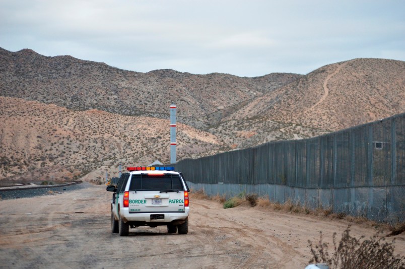 In this Jan. 4, 2016 photo, a U.S. Border Patrol agent patrols Sunland Park along the U.S.-Mexico border next to Ciudad Juarez. The New Mexico border town, next to El Paso, Texas, has struggled to put a series of national scandals behind it until two city councilors were recently arrested. (AP Photo/Russell Contreras)