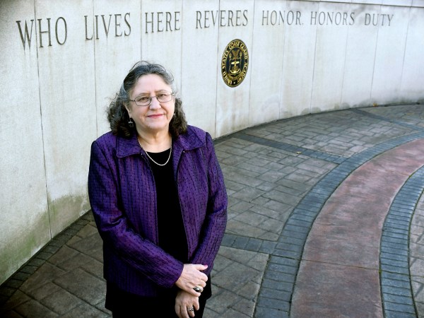 Michele Fitzpatrick, a retired lieutenant commander in the Coast Guard, poses for a photograph at the United States Coast Guard Academy in New London, Conn., Tuesday, Dec. 18, 2018. Female veterans, both current and former service members, were more likely to vote in the 2018 midterm elections for Democrats than Republicans, 60 percent to 36 percent, according to data from VoteCast. (AP Photo/Jessica Hill)