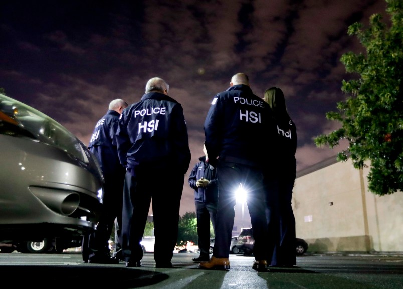 EMBARGOED UNTIL NOON EASTERN TIME -- U.S. Immigration and Customs Enforcement agents gather before serving a employment audit notice at a 7-Eleven convenience store Wednesday, Jan. 10, 2018 in Los Angeles. Agents targeted about 100 7-Eleven stores nationwide Wednesday to open employment audits and interview workers. (AP Photo/Chris Carlson)