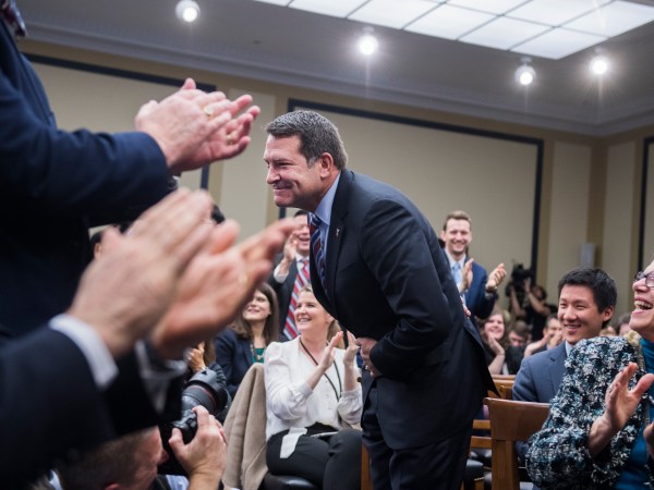 UNITED STATES - NOVEMBER 30: Rep.-elect Mark Green, R-Tenn.,  takes a bow after drawing number 85, the last pick of office space, during the new member room lottery draw for office space in Rayburn Building on November 30, 2018. (Photo By Tom Williams/CQ Roll Call)