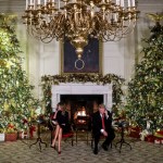 WASHINGTON, DC - DECEMBER 24: President Donald Trump and first lady Melania Trump speak on the phone with children as they track Santa Claus with the North American Aerospace Defense Command, NORAD, on Christmas Eve in the State Dinning Room of the White House on December 24, 2018 in Washington, DC.(Photo by Oliver Contreras/For The Washington Post)