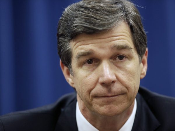 North Carolina Attorney General Roy Cooper, a Democrat, has condemned his state's Republican-sponsored voter ID law and constitutional amendment to ban same-sex marriage. But in his position he must defend the state against lawsuits on both issues. (Raleigh News & Observer/MCT)