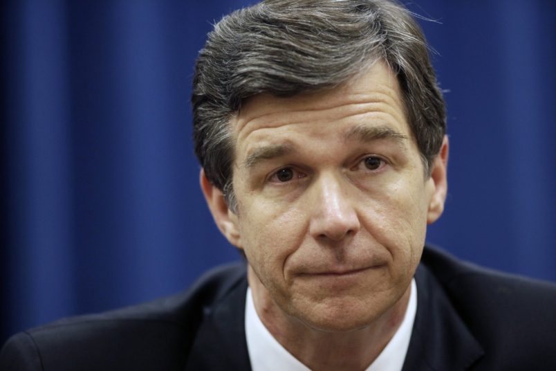 North Carolina Attorney General Roy Cooper, a Democrat, has condemned his state's Republican-sponsored voter ID law and constitutional amendment to ban same-sex marriage. But in his position he must defend the state against lawsuits on both issues. (Raleigh News & Observer/MCT)