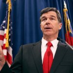 North Carolina Attorney General Roy Cooper, a Democrat, has condemned his state's Republican-sponsored voter ID law and constitutional amendment to ban same-sex marriage. But in his position he must defend the state against lawsuits on both issues. (Takaaki Iwabu/Raleigh News & Observer/MCT)