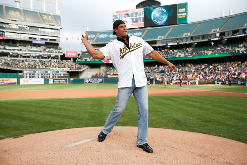 OAKLAND, CA - SEPTEMBER 3: Jose Canseco throws out the ceremonial first pitch prior to the game between the Oakland Athletics and the Boston Red Sox at the Oakland Coliseum on September 3, 2016 in Oakland, California. The Red Sox defeated the Athletics 11-2. (Photo by Michael Zagaris/Oakland Athletics/Getty Images)  *** Local Caption *** Jose Canseco