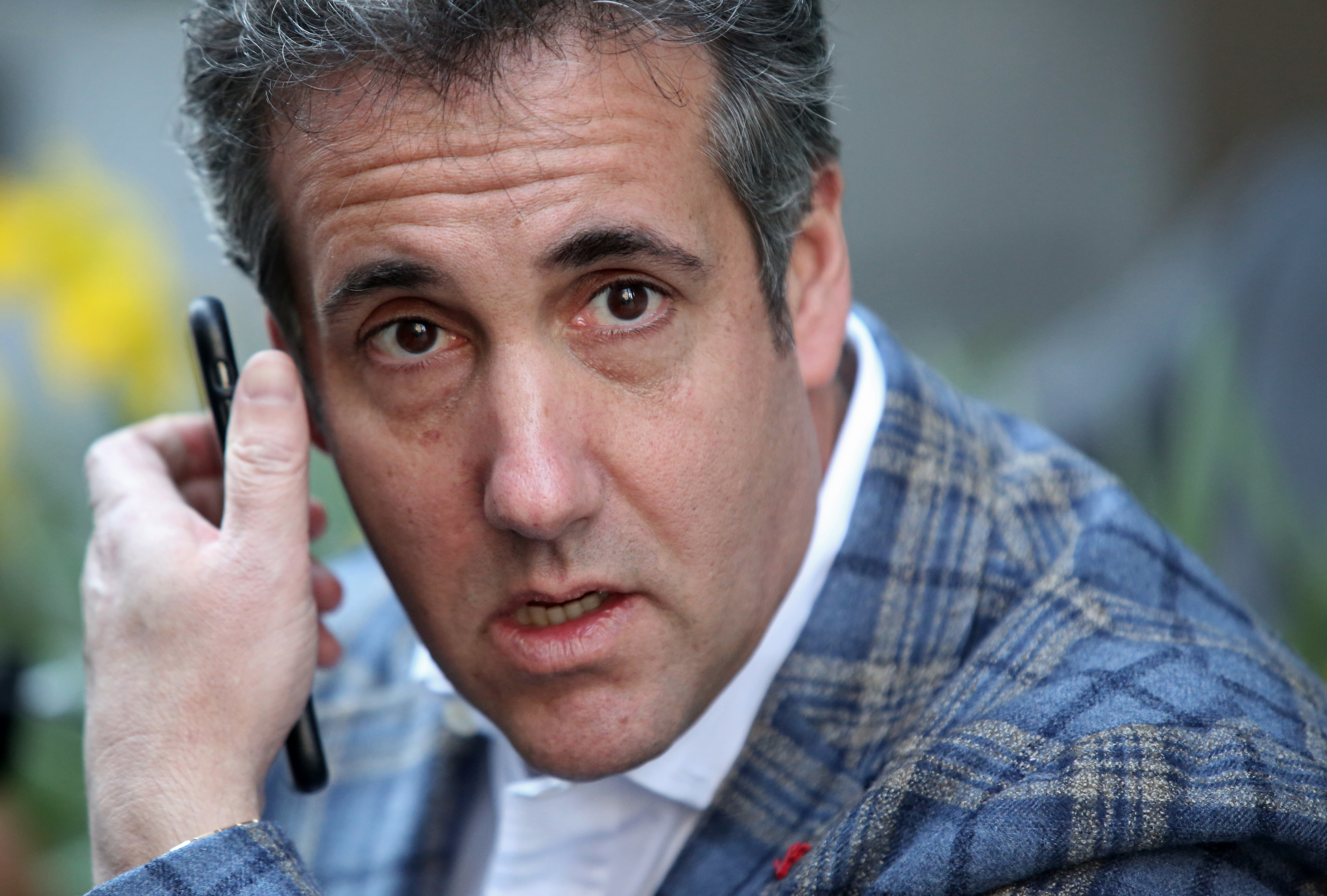 NEW YORK, NY - APRIL 13: Michael Cohen, President Donald Trump's attorney, takes a phone call near the Loews Regency hotel on Park Ave on April 13, 2018 in New York City. Following FBI raids on his home, office and hotel room, the Department of Justice announced that they are placing him under criminal investigation. (Photo by Yana Paskova/Getty Images)