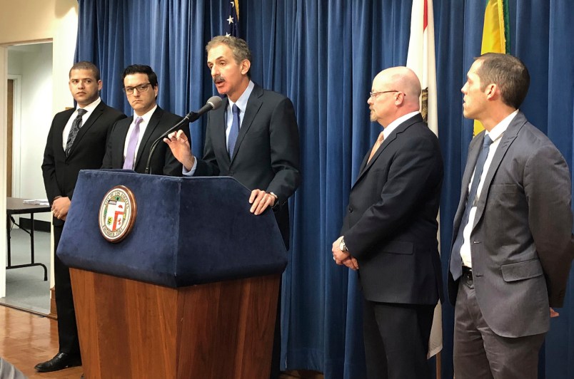 Los Angeles City Attorney Mike Feuer, at podium, speaks at a news conference in Los Angeles Friday, Jan. 4, 2019. Feuer said that owners of The Weather Channel app, one of the most popular mobile weather apps, used it to track people's every step and profit off that information. Feuer said the company misled users of the popular app to think their location data will only be used for personalized forecasts and alerts. A spokesman for app owner IBM Corp. says it's been clear about the use of location data and will vigorously defend its "fully appropriate" disclosures. (AP Photo/Brian Melley)