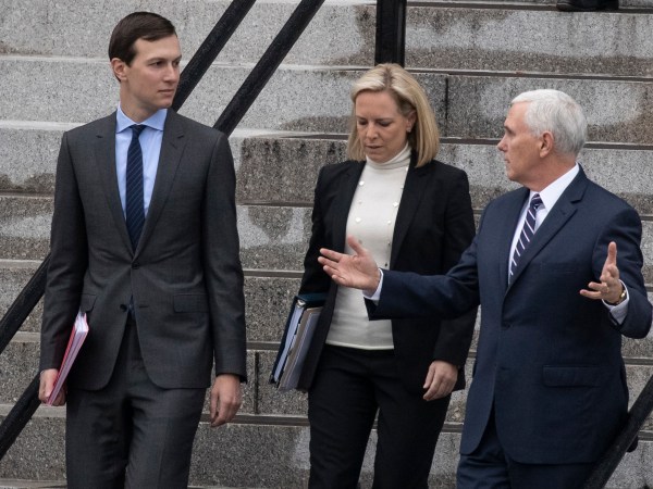 White House Senior Adviser Jared Kushner, left, Homeland Security Secretary Kirstjen Nielsen, and Vice President Mike Pence, talk as they walk down the steps of the Eisenhower Executive Office Building on the White House complex, Saturday, Jan. 5, 2019, in Washington. (AP Photo/Alex Brandon)