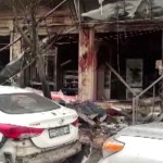 This frame grab from video provided by Hawar news, the news agency for the semi-autonomous Kurdish areas in Syria (ANHA), shows the damaged restaurant where explosion occurred near a patrol of the U.S.-led coalition, in Manbij town, Syria, Wednesday, Jan. 16, 2019. A Syrian war monitoring group and a local town council say an explosion has taken place near a patrol of the U.S.-led coalition and that there are casualties. (ANHA via AP)