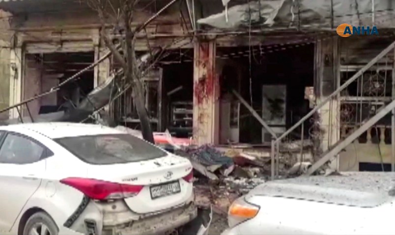 This frame grab from video provided by Hawar news, the news agency for the semi-autonomous Kurdish areas in Syria (ANHA), shows the damaged restaurant where explosion occurred near a patrol of the U.S.-led coalition, in Manbij town, Syria, Wednesday, Jan. 16, 2019. A Syrian war monitoring group and a local town council say an explosion has taken place near a patrol of the U.S.-led coalition and that there are casualties. (ANHA via AP)