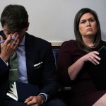 WASHINGTON, DC - OCTOBER 03:  White House Press Secretary Sarah Sanders (R) and White House Deputy Press Secretary Hogan Gidley (L) listen during a White House news briefing at the James Brady Press Briefing Room of the White House October 3, 2018 in Washington, DC. Sanders held a news briefing to answer questions from members of the White House press corps.  (Photo by Alex Wong/Getty Images) *** Local Caption *** Sarah Sanders; Hogan Gidley
