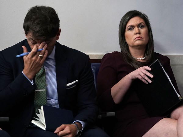 WASHINGTON, DC - OCTOBER 03:  White House Press Secretary Sarah Sanders (R) and White House Deputy Press Secretary Hogan Gidley (L) listen during a White House news briefing at the James Brady Press Briefing Room of the White House October 3, 2018 in Washington, DC. Sanders held a news briefing to answer questions from members of the White House press corps.  (Photo by Alex Wong/Getty Images) *** Local Caption *** Sarah Sanders; Hogan Gidley