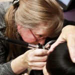 Doctor Sue Haverkamp, examining a young patient while Maria Figueroa holds her, at Erie Helping Hands Health Center, at 4747 N. Kedzie Avenue, in Chicago, on Wednesday Nov. 28, 2018.(Nuccio DiNuzzo/Chicago Tribune/TNS)