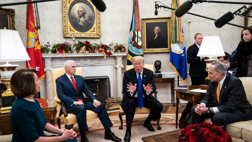 WASHINGTON, DC - DECEMBER 11 : President Donald J. Trump debates with House Minority Leader Nancy Pelosi, D-Calif., left, and Senate Minority Leader Chuck Schumer, D-N.Y., right, as Vice President Mike Pence listens during a meeting in the Oval Office of White House on Tuesday, Dec. 11, 2018 in Washington, DC. (Photo by Jabin Botsford/The Washington Post)