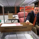 Seminole County, Fla., Elections Supervisor Michael Ertel grabs a box of ballots during the count of 600 provisional ballots, in Sanford, Florida, Thursday, November 8, 2012. In background, Richard Siwica, counsel for Mike Clelland, the challenger that is currently leading incumbent Chris Dorworth, looks on. (Joe Burbank/Orlando Sentinel/MCT)