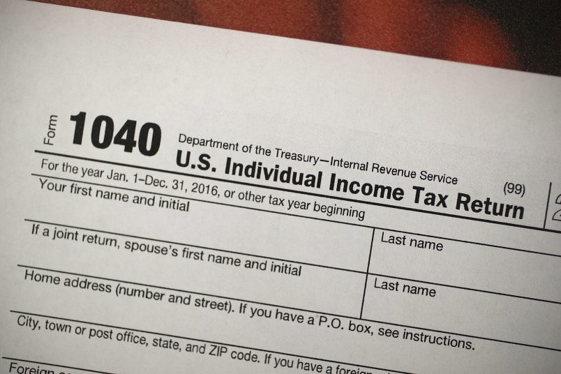 MIAMI, FL - DECEMBER 22:  A copy of a IRS 1040 tax form is seen at an H&R Block office on the day President Donald Trump signed the Republican tax cut bill in Washington, DC  on December 22, 2017 in Miami, Florida. Kathy Pickering, vice president of regulatory affairs and executive director of The Tax Institute at H&R Block released a statement about the new tax bill saying, " ItÕs going to change the way you think about and plan your income taxes. YouÕll need to take a fresh look at your individual situation to know your outcome and new strategies to use to get the best tax outcome.Ó  (Photo by Joe Raedle/Getty Images)