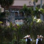 Staff carry trays of coffee at Mar-a-Lago while US President Donald Trump visits his property March 24, 2018 in Palm Beach, Florida. / AFP PHOTO / Brendan Smialowski        (Photo credit should read BRENDAN SMIALOWSKI/AFP/Getty Images)
