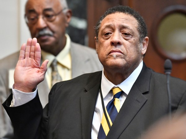 FILE - In this Jan. 8, 2019 file photo, incoming state Rep. Jim Glenn, D-Owensboro, is sworn in during a ceremony at the Kentucky House of Representatives in Frankfort, Ky. Election officials in Kentucky are reviewing ballots cast in a Kentucky House race where Glenn was elected by just one vote. The Democrat defeated Republican state Rep. DJ Johnson by one vote in November. But the Republican-controlled state legislature ordered a recount in the race after Johnson asked for it. (AP Photo/Timothy D. Easley, File)