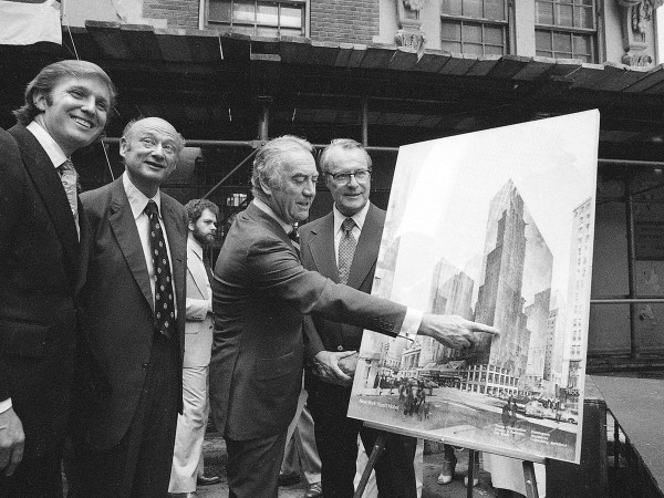 FILE - In this June 28, 1978, file photo, New York Gov Hugh Carey points to an artists' conception of the new New York Hyatt Hotel/Convention facility that will be build on the site of the former Commordore Hotel in New York. Now called the Grand Hyatt New York, the building that helped Donald Trump make a name for himself in his first big deal in Manhattan is being sold to developers who plan to tear it down. From left are: Donald Trump; New York Mayor Mayor Ed Koch; Carey; and Robert T. Dormer, executive vice president of the Urban Development Corp. (AP Photo)