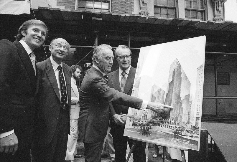 FILE - In this June 28, 1978, file photo, New York Gov Hugh Carey points to an artists' conception of the new New York Hyatt Hotel/Convention facility that will be build on the site of the former Commordore Hotel in New York. Now called the Grand Hyatt New York, the building that helped Donald Trump make a name for himself in his first big deal in Manhattan is being sold to developers who plan to tear it down. From left are: Donald Trump; New York Mayor Mayor Ed Koch; Carey; and Robert T. Dormer, executive vice president of the Urban Development Corp. (AP Photo)