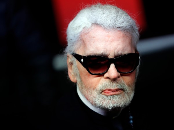 Fashion designer Karl Lagerfeld poses during the Champs Elysee Avenue illumination ceremony for the Christmas season, in Paris, Thursday, Nov. 22, 2018. (AP Photo/Christophe Ena)