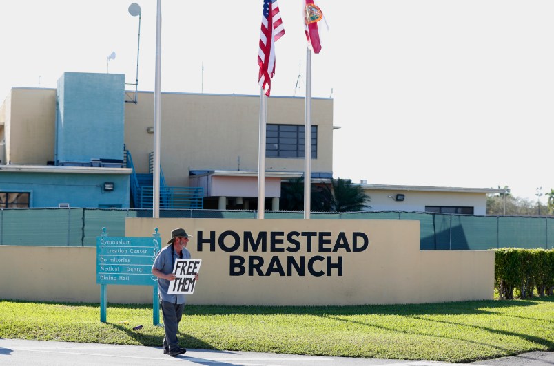 Josh Rubin demonstrates in front of the Homestead Temporary Shelter for Unaccompanied Children, Tuesday, Feb. 19, 2019, in Homestead, Fla. (AP Photo/Wilfredo Lee)
