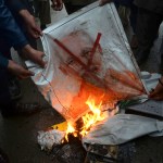 Pakistani protesters burn a poster of Indian Prime Minister Narendra Modi during an anti-Indian rally in Peshawar, Pakistan, Tuesday, Feb. 26, 2019. Pakistan said India launched an airstrike on its territory early Tuesday that caused no casualties, while India said it targeted a terrorist training camp in a pre-emptive strike that killed a "very large number" of militants. (AP Photo/Muhammad Sajjad)