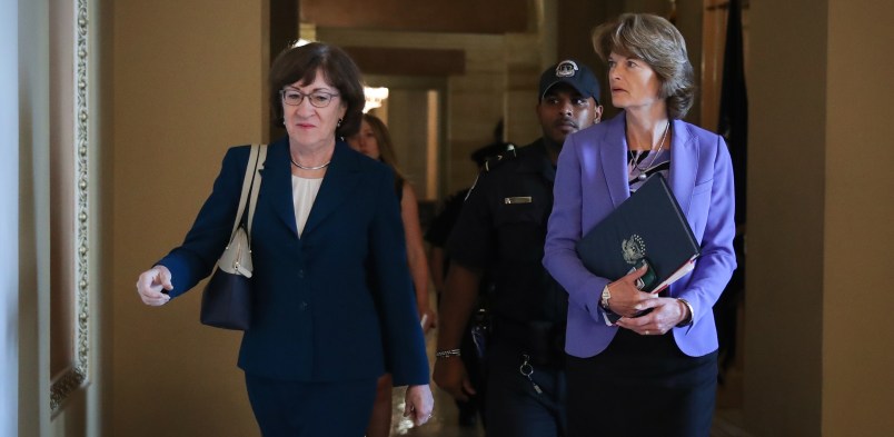 WASHINGTON, DC - OCTOBER 3: (L-R) Sen. Susan Collins (R-ME) and Sen. Lisa Murkowski (R-AK) walk together as they arrive to a closed-door lunch meeting of GOP Senators at the U.S. Capitol, October 3, 2018 in Washington, DC. An FBI report on current allegations against Supreme Court nominee Brett Kavanaugh is expected by the end of this week, possibly later today. (Photo by Drew Angerer/Getty Images)