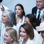 UNITED STATES - FEBRUARY 05: Rep. Alexandria Ocasio-Cortez, D-N.Y., top center, and Speaker Nancy Pelosi, D-Calif., bottom center, pose for a group photo of House Democrats in the Capitol Visitor Center, who plan to wear "suffragette white" to the State of the Union address to show solidarity for women's agendas on Tuesday, February 5, 2019. (Photo By Tom Williams/CQ Roll Call)