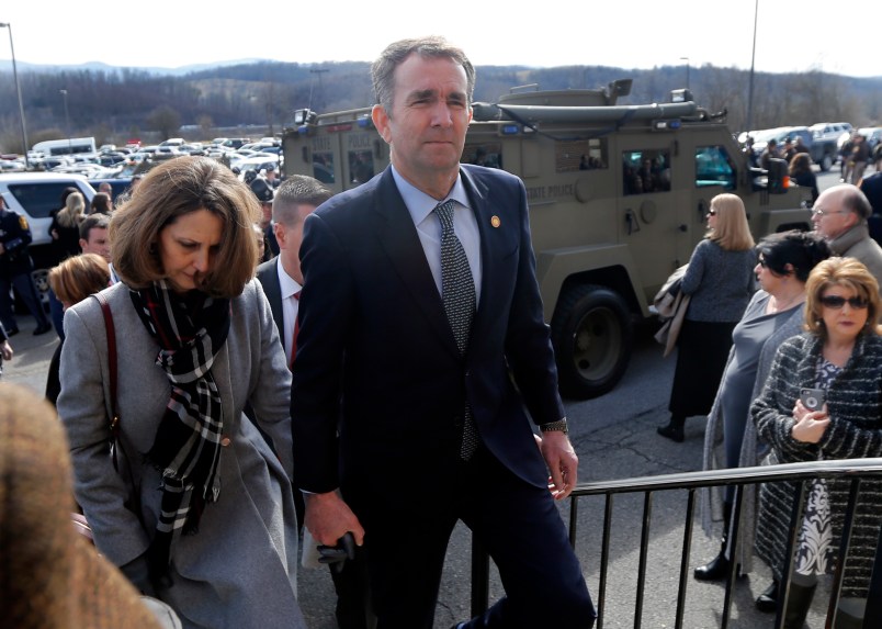 Virginia Gov. Ralph Northam, left,  and his wife Pam, left, leave the funeral of fallen Virginia State Trooper Lucas B. Dowell after the church service for the funeral at the Chilhowie Christian Church in Chilhowie, Va., Saturday, Feb. 9, 2019. Dowell was killed  in the line of duty earlier in the week. (AP Photo/POOL/Steve Helber)