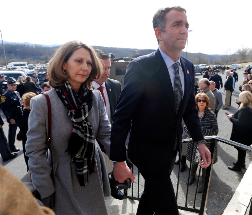 Virginia Gov. Ralph Northam, left,  and his wife Pam, left, leave the funeral of fallen Virginia State Trooper Lucas B. Dowell after the church service for the funeral at the Chilhowie Christian Church in Chilhowie, Va., Saturday, Feb. 9, 2019. Dowell was killed  in the line of duty earlier in the week. (AP Photo/POOL/Steve Helber)