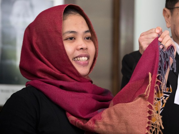 Indonesian Siti Aisyah, left, greets by her lawyer Gooi Soon Seng after a press conference at Indonesian Embassy in Kuala Lumpur, Malaysia, Monday, March 11, 2019. The Indonesian woman held two years on suspicion of killing the North Korean leader's half brother was freed from custody Monday, March 11, 2019 after prosecutors unexpectedly dropped the murder charge against her.  (AP Photo/Vincent Thian)
