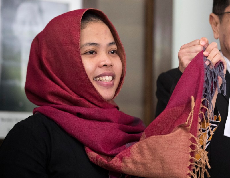Indonesian Siti Aisyah, left, greets by her lawyer Gooi Soon Seng after a press conference at Indonesian Embassy in Kuala Lumpur, Malaysia, Monday, March 11, 2019. The Indonesian woman held two years on suspicion of killing the North Korean leader's half brother was freed from custody Monday, March 11, 2019 after prosecutors unexpectedly dropped the murder charge against her.  (AP Photo/Vincent Thian)