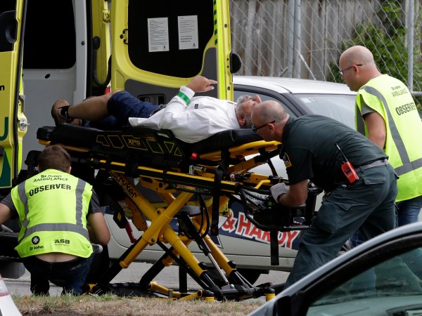 Ambulance staff take a man from outside a mosque in central Christchurch, New Zealand, Friday, March 15, 2019. (AP Photo/Mark Baker)