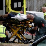 Ambulance staff take a man from outside a mosque in central Christchurch, New Zealand, Friday, March 15, 2019. (AP Photo/Mark Baker)