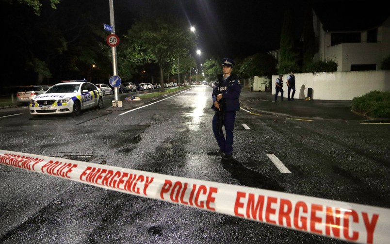 A policeman patrols at a cordon near a mosque in central Christchurch, New Zealand, Friday, March 15, 2019. Multiple people were killed in mass shootings at two mosques full of worshippers attending Friday prayers on what the prime minister called "one of New Zealand's darkest days," as authorities detained four people and defused explosive devices in what appeared to be a carefully planned attack. (AP Photo/Mark Baker)
