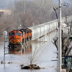 A BNSF train sits in flood waters from the Platte River, in Plattsmouth, Neb., Sunday, March 17, 2019.  Hundreds of people remained out of their homes in Nebraska, but rivers there were starting to recede. The National Weather Service said the Elkhorn River remained at major flood stage but was dropping. (AP Photo/Nati Harnik)