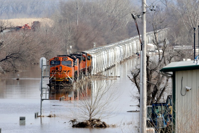 A BNSF train sits in flood waters from the Platte River, in Plattsmouth, Neb., Sunday, March 17, 2019.  Hundreds of people remained out of their homes in Nebraska, but rivers there were starting to recede. The National Weather Service said the Elkhorn River remained at major flood stage but was dropping. (AP Photo/Nati Harnik)