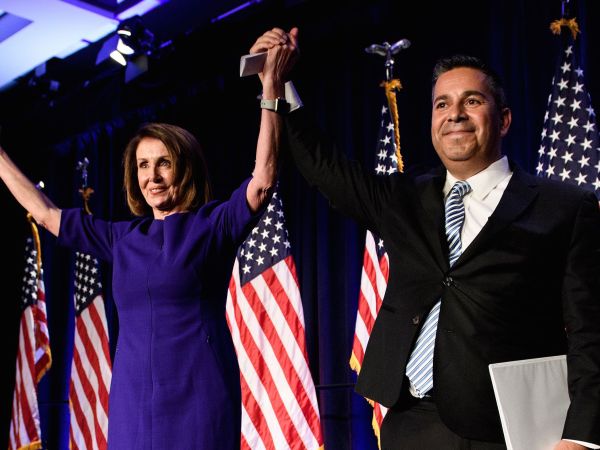 TOPSHOT - House Minority Leader Nancy Pelosi (D-CA) and Representative Ben Ray Lujan (D-MN), DCCC Chairman, celebrate a projected Democratic Party takeover of the House of Representatives during a midterm election night party hosted by the Democratic Congressional Campaign Committee on November 7, 2018 in Washington, DC. (Photo by Brendan Smialowski / AFP) / ALTERNATIVE CROP        (Photo credit should read BRENDAN SMIALOWSKI/AFP/Getty Images)